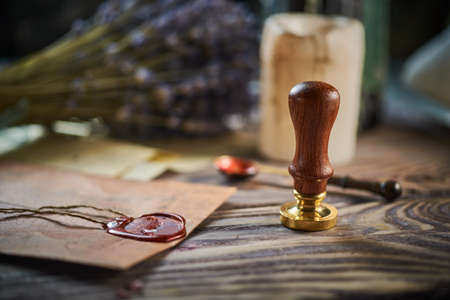 Sealing wax on ancient papers, antique stamp, and old documents, brass spoonの写真素材