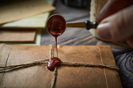 Sealing wax on ancient papers, antique stamp, and old documents, brass spoonの写真素材