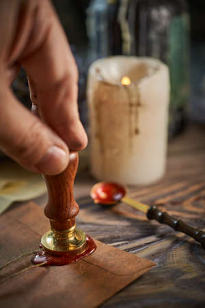 Sealing wax on ancient papers, antique stamp, and old documents, brass spoonの写真素材