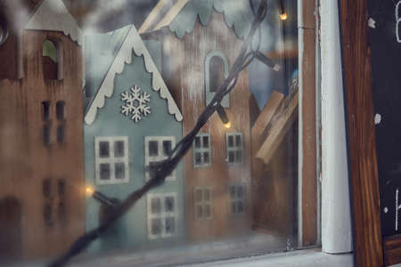 Miniature houses, tiny christmas decoration in the window