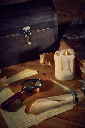 Pirate still life with a treasure chest on wooden tableの写真素材