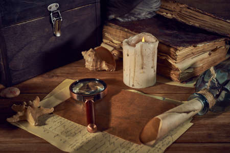 Pirate still life with a treasure chest on wooden tableの写真素材