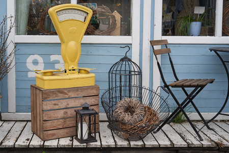 Vintage gas stove and a basket on a wooden benchの写真素材