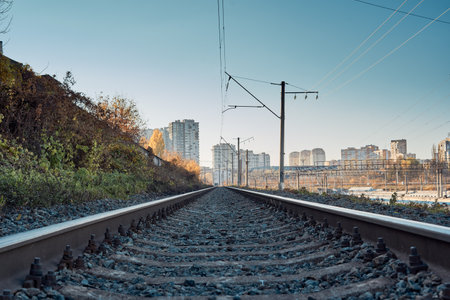 Railway tracks on the background of the city and blue sky.の写真素材