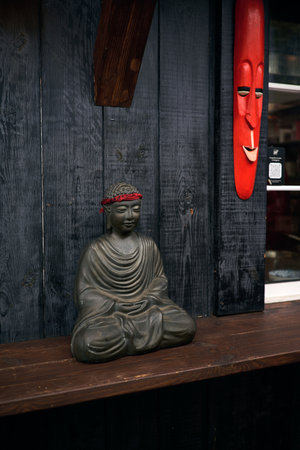 Buddha statue in front of a shop window