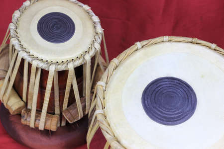 Indian tabla drums on a red background. close upの写真素材