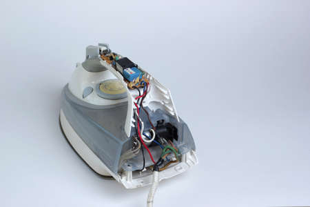 Broken iron. The concept of repair of electrical household.の写真素材