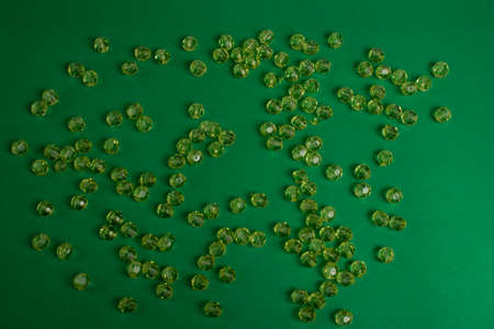 Green beads on a green backgroundの写真素材