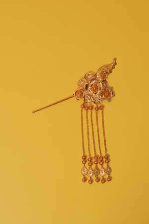 Chinese hairpin hair clips on a yellow background. Chinese traditional jewelry.の写真素材