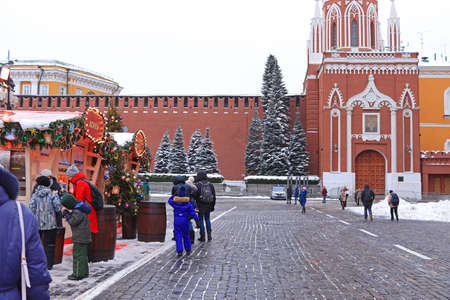 MOSCOW, RUSSIA - DECEMBER 8, 2021: a skating rink on Red Square and a lot of people walking at the Christmas New Year's Fair. Inscription: Gum-Skating Rinkのeditorial素材
