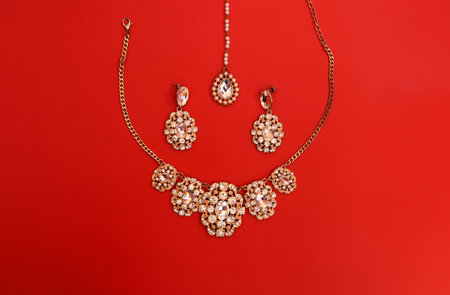 Traditional Indian jewelry is gold with gems. Necklace, earrings, tika.の写真素材