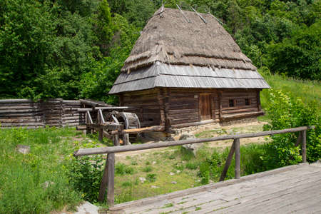 mill is not working is made with wood. foreground bridge. Around the mill forestの写真素材