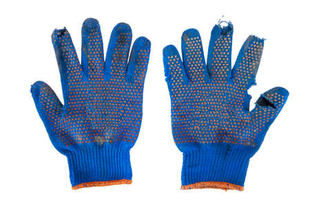 a pair of torn blue gloves on a white backgroundの写真素材