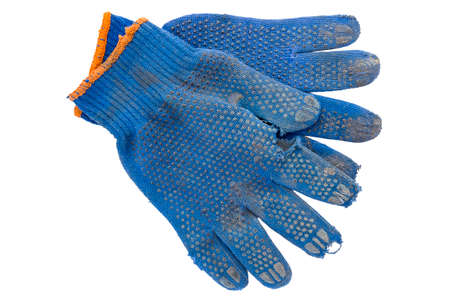 a pair of torn blue gloves for the job.の写真素材