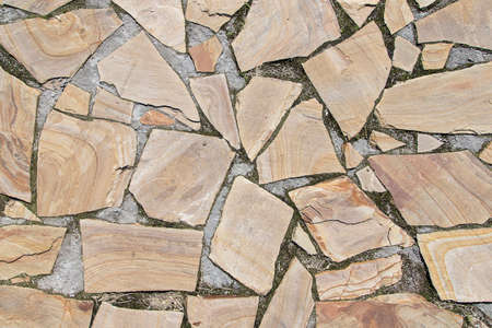 paving blocks of yellow stone on the roadの写真素材