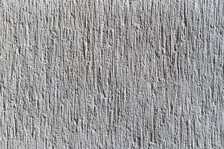 gray cement wall with a relief textureの写真素材