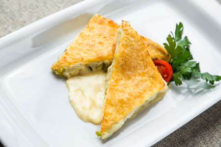 two slices, onion pie with cream sauceの写真素材
