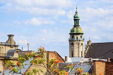 view over the roof of Lviv. there is a bell tower with a clockの写真素材