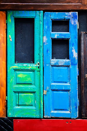 old wooden blue and green doors