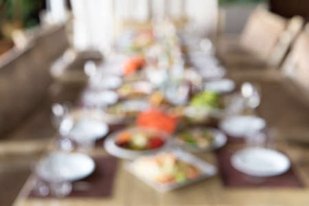 blurred served table in restaurant, background