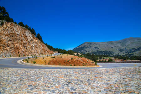 Serpentine road in the rocksの写真素材