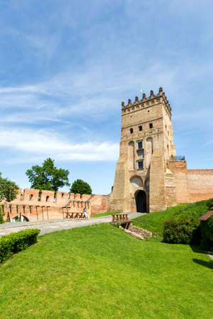 entry in Lutsk castle. summer day, there is green grass in front of the castle.の写真素材