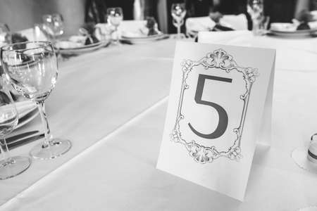 Wedding table with the sign number five, pictures in BWの写真素材