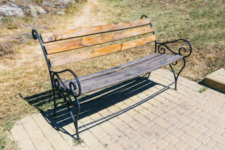 wooden bench in the park.