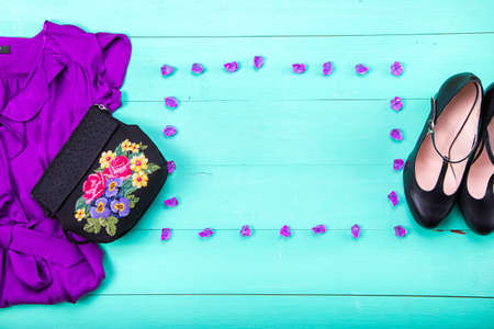 women's clothes - dress, embroidered bag, black heels, earrings, nail polish, lipstick. turquoise...