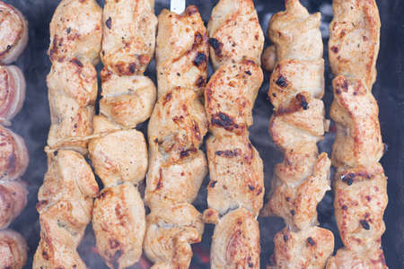 barbecue on the grill, meat threaded on skewers, summer picnicの写真素材