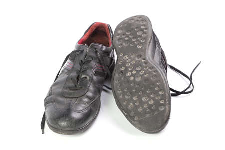 worn black men's shoes isolated isolated on white backgroundの写真素材