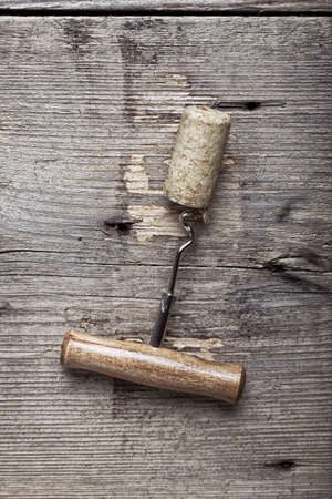 cork and corkscrew on a grunge wooden background. top viewの写真素材
