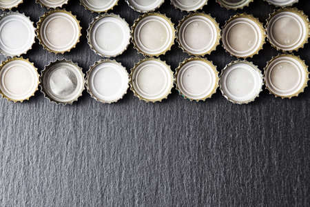 Cover of beer on slate blackboard, top viewの写真素材