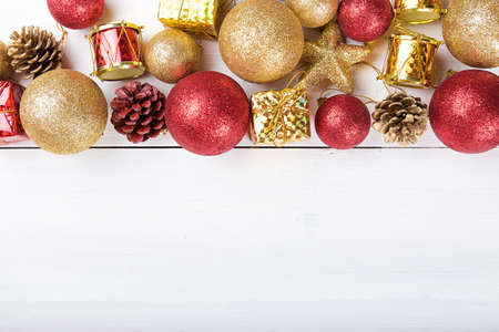 Christmas set, Christmas toys space for text on the greeting card. gold and red toy.の写真素材