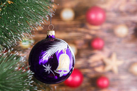 on bokeh background Christmas toy ball is hanging on a Christmas tree. space for text.の写真素材
