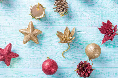 Christmas toys on the Christmas tree on a blue wooden backgroundの写真素材