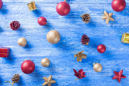 Christmas toys on the Christmas tree on a blue wooden backgroundの写真素材