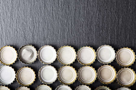 Cover of beer on slate blackboard, top view