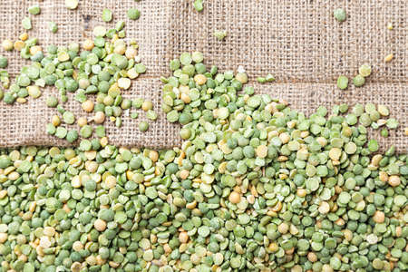 uncooked peas scattered on the sacking, a dietary nutritional product