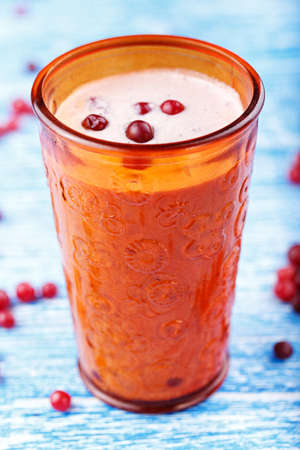 healthy nutritious breakfast with milk, cottage cheese, and cranberry - Cranberry smoothie in a glassの写真素材