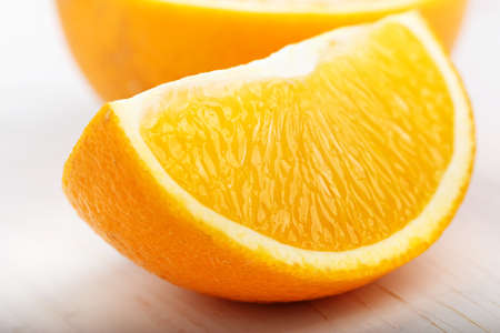 slice of ripe juicy orange on a white background