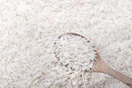 spilled crude basmati rice background, well some grain visibleの写真素材