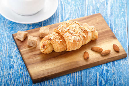 nutritious delicious breakfast of black coffee with croissants in the almond flakesの写真素材