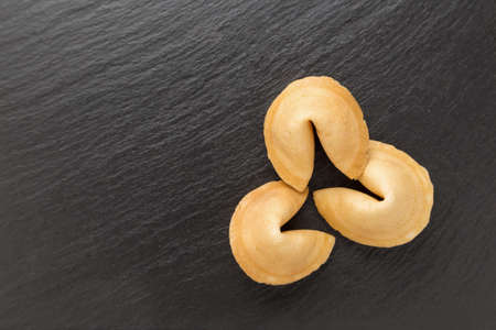 traditional Chinese pastry with the wishes or predictions on a black backgroundの写真素材