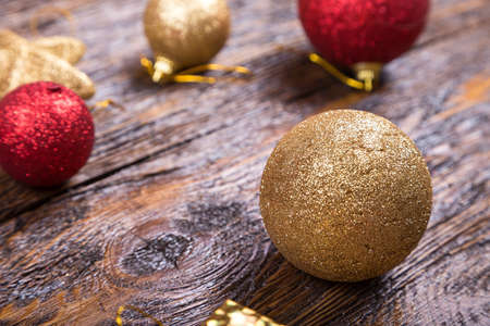 bright Christmas toy on a wooden background. Christmas and New Year, Christmas tree decoration.の写真素材