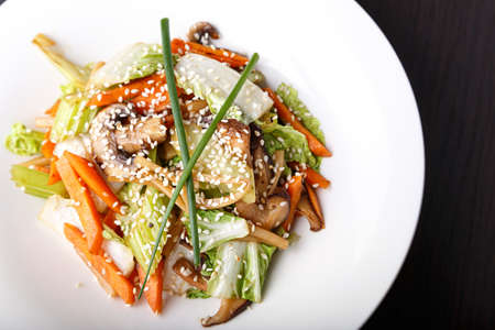 vegetable salad with mushrooms, sesame seeds, lettuce, carrots and celery.の写真素材
