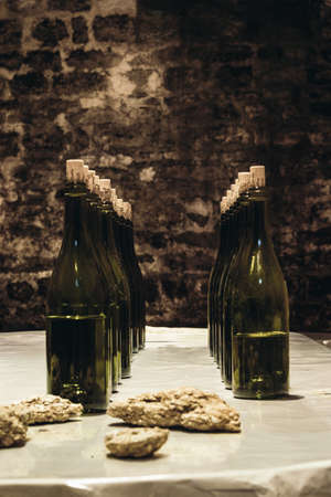 Wine bottles on the table, winemaking as a business, wine cellar