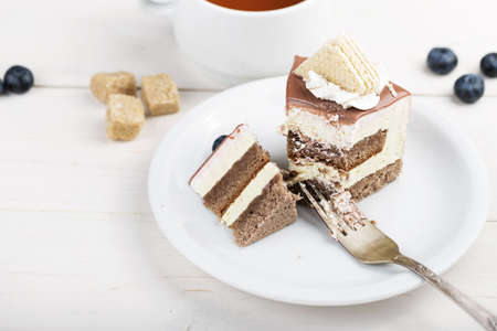 The cake of cake began to be eaten, the coffee cake with cream and blueberriesの写真素材