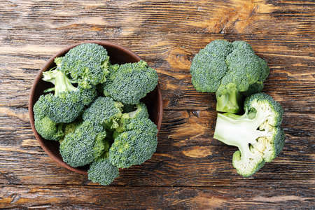 inflorescence of raw broccoli on a conservative background, a useful vegetarian dishの写真素材