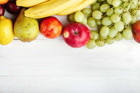 fruit background with exotic fruits on white background, fruit detox, space for textの写真素材